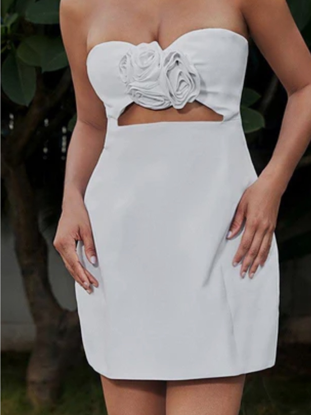 Strapless White cut out mini dress with floral appliqué